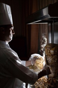 Chef carving a schwarma / souvlaki / kebab