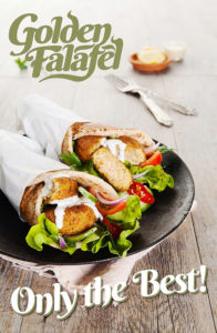 An image of 2 falafel & salad wraps being served on a rustic tin plate atop a timber table